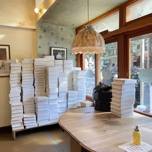 stacks of pizza sitting on a table