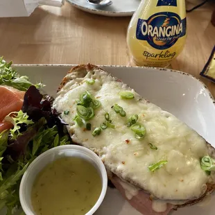 Croque monsieur, petite salade &amp; champagne vinaigrette, and Orangina