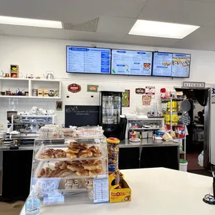 a counter with a variety of pastries