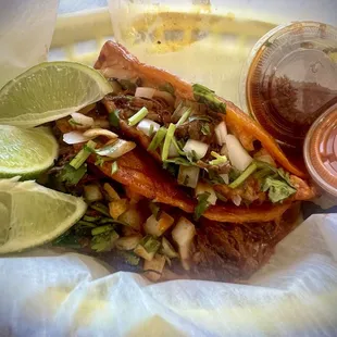 Birria tacos with dipping sauces