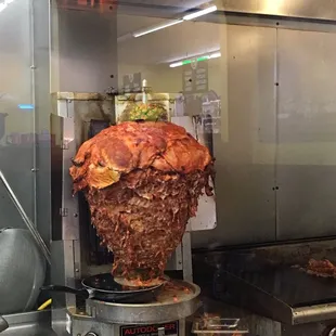 a ham being cooked in a commercial kitchen