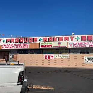 a truck parked in front of the store