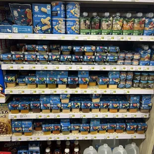 a shelf full of milk and other beverages