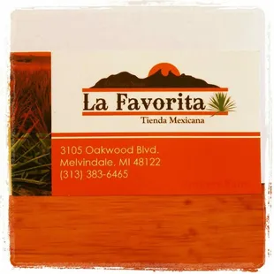 a business card on a wooden table