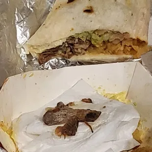 Birria Super  with a small shaving of a bone in front of the much bigger bone