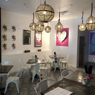 tables, chairs, and artwork