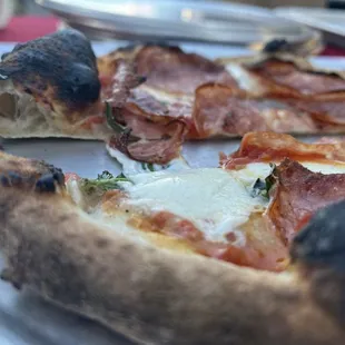 a slice of pizza on a plate