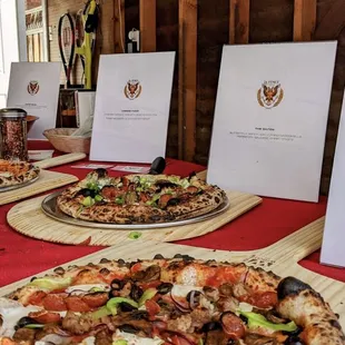 a table with pizzas on it