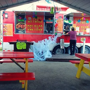 a woman ordering food from a food truck