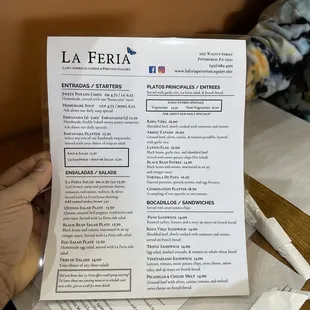 a person holding a menu