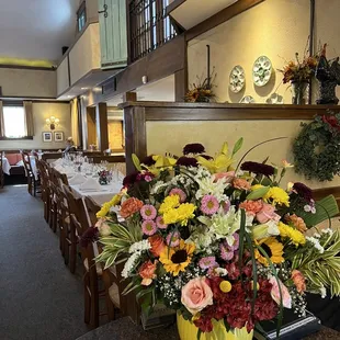 a large vase of flowers on a table