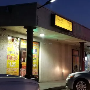 cars parked in front of a restaurant