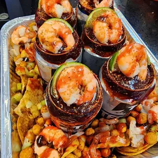 a platter of shrimp and tortillas