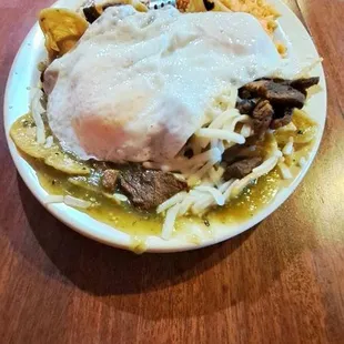 a plate of food on a wooden table