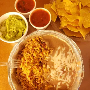The guac and chips, salsa, side of beans and rice. #yum #ReviewsByRL