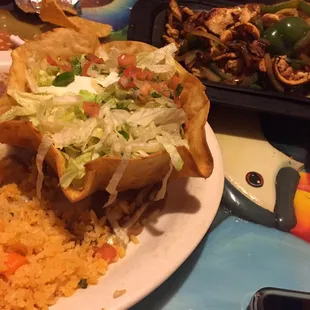 The fajita sides come in a taco shell bowl... I&apos;ve never seen that before.