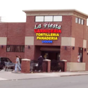 people walking in front of the store