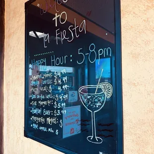a sign with a cocktail