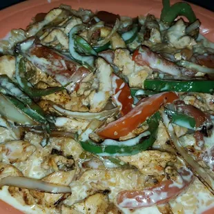 Ranchero Especially - chicken, cheese, rice, peppers, onions.