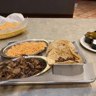 Tacos De Carne Asada, Mushrooms and Spanish Rice!  Side of cilantro with onions, jalapeños, sour cream &amp; salsa verde!!