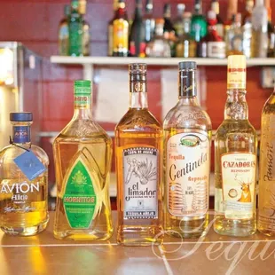 a variety of liquor bottles