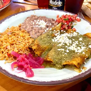 Enchiladas of chicken, chorizo, and cheese and onions
