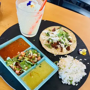 Chorizo soft shell corn tortilla for lunch with cilantro lime rice and homemade cucumber water!