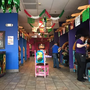 Some seating, bright, cozy and festive. Plenty of waiters to help everyone!