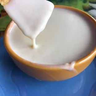 Queso, has a little zing to it, served fresh and hot!