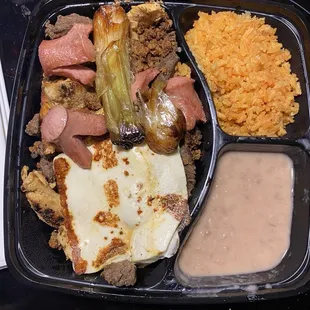 Steak and chicken, fajita grilled cheese, rice and beans and these crazy little octopus things made of hotdogs