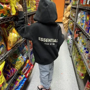 a little boy in a black hoodie