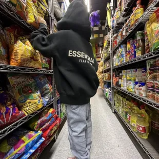 a little boy in a black hoodie