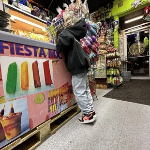 a person leaning against a counter