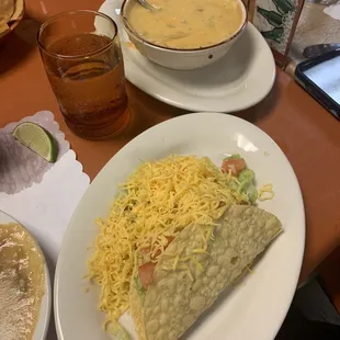 Beef taco and bean tostada portion of Large Combination, and Queso