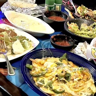 Shrimp Fajita entree with fixings and queso boat.