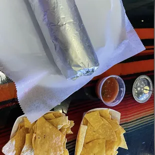 burrito with freshly baked chips and salsa/queso
