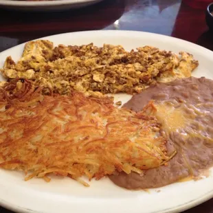 Chorizo &amp; eggs with hash browns and beans.