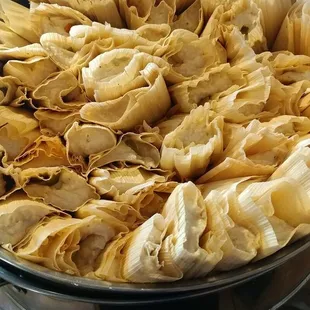 a large pan full of tortillas