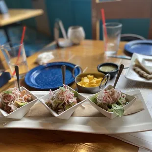 Trio de Ceviches with a side of fresh mango