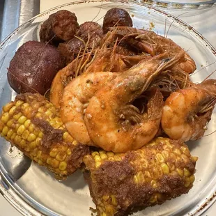 Shrimp, sausage, corn and potatoes in house special sauce with medium heat