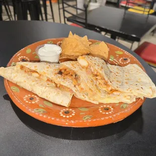 a plate of quesadillas and chips