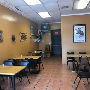 empty tables and chairs in a restaurant
