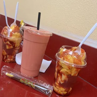 two cups of ice cream and a drink