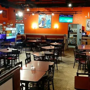 La Flor, bar counter on the left, tables, booths, a very big place.