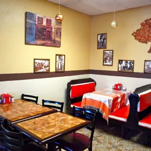 Spacious view of the inside seating area: tables and booths.