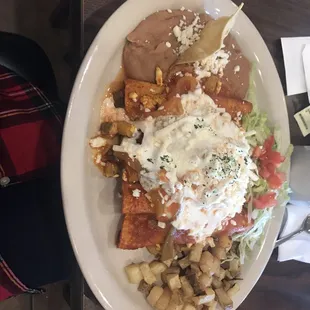 Ojos de Pancho. Pancho&apos;s Eyes. Enchiladas filled w queso fresco topped w fried eggs. Yum