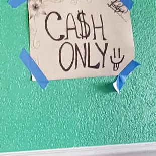 a sign that says cash only