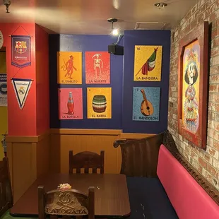 a dining area with colorful booths