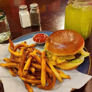 Green chile cheeseburger with fries, side of ketchup, and pineapple cucumber water.