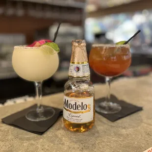 two cocktails on a bar